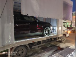 Эвакуатор FUSO c приоткрытым ВИП кузовом, вид с другой стороны - RaceExpress, Тюмень